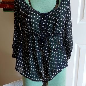 Kirra sheer black top with white bows